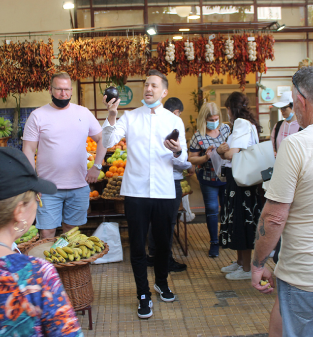 Visit a local market and taste the produce